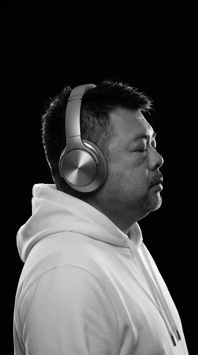 Coach BK Han, Singapore AI Innovation Coach, black-and-white profile portrait wearing headphones